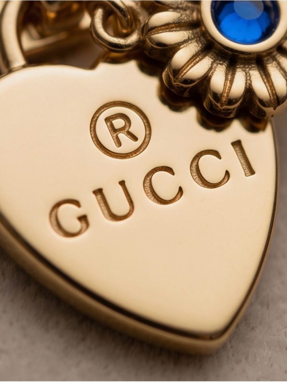 Gucci Gold Heart Charm with Blue Stone Accent 20 inch gold chain. Gucci box.